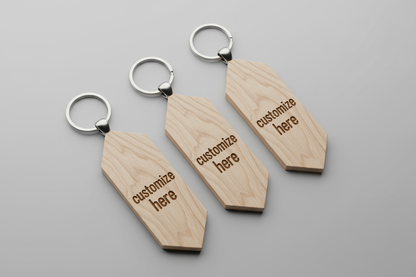 custom wood keychains in elongated hexagonal shape with "customize here" written on it