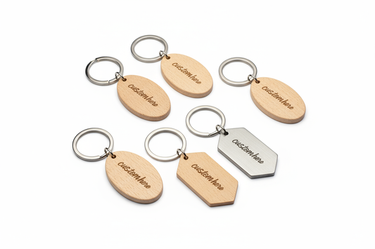 its both wood and metal keychains with the shape of a oval or elongated hexagon only. writing should just say "custom here"